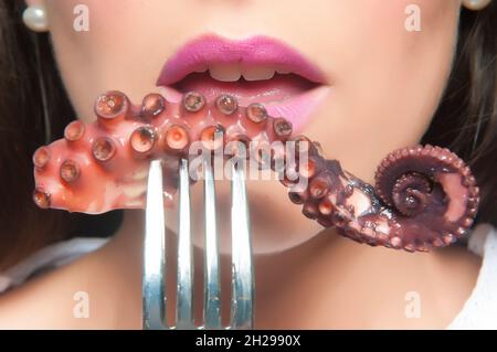 woman's mouth eating with a fork Stock Photo