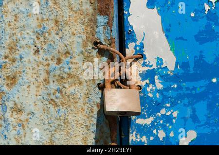 iron doors in the foreground rusty and useless Stock Photo