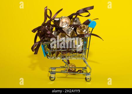 metal bells with ribbon bows in the shopping basket.  Stock Photo