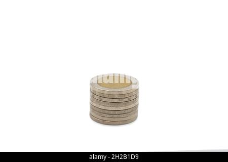 10 Baht coins; The Thai silver and gold color inside the coin, with temple sign inside of it on white background. Clipping Path. Stock Photo