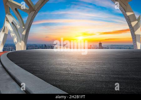 Asphalt road and city skyline at sunrise in Shanghai. Stock Photo