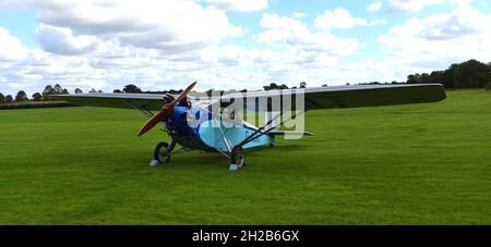 Vintage 1931 Civilian Coupe 02 G-ABNT  aircraft  on airstrip grass. Stock Photo