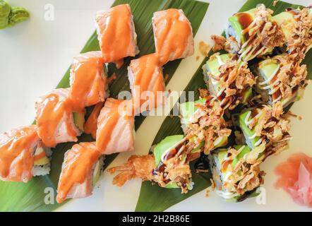 Top view of sushi roll set with fish , salmon avocado and shrimps.Delicious japanese food background. Stock Photo