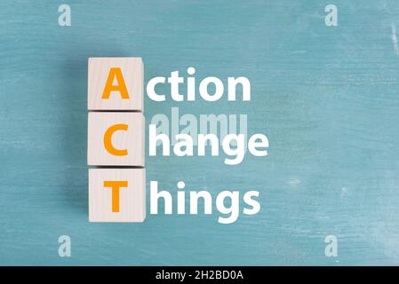 The words action, change, things are standing on a blue colored background, business concept Stock Photo