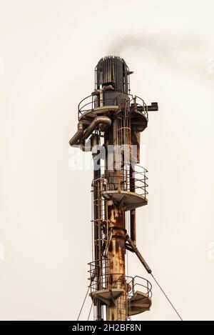 close up of a Chemical plant exhaust stack with smoke coming out Stock Photo