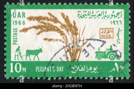 EGYPT - CIRCA 1966: stamp printed by Egypt, shows, plougher, tractor, circa 1966 Stock Photo