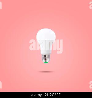 LED energy saving lamp 230v isolated on red pastel color background Stock Photo