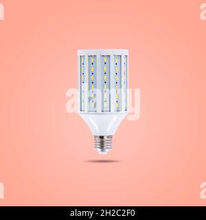 LED energy saving lamp 230v isolated on orange pastel color background Stock Photo