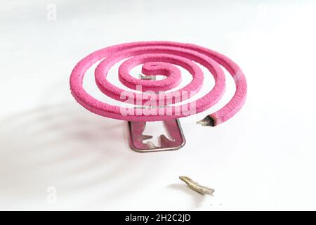 Pink mosquito repellent on white background. Stock Photo