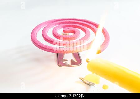 Pink mosquito repellent on white background. Stock Photo