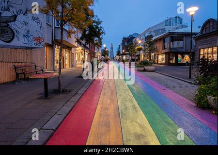 Reykjavik, Iceland – September 22, 2021:  Downtown street with a rainbow flag painted on the pavement Stock Photo