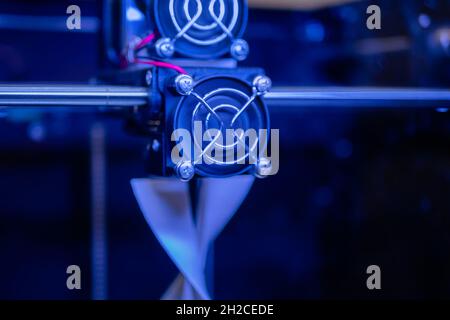 3D printer making physical plastic model at modern technology exhibition Stock Photo