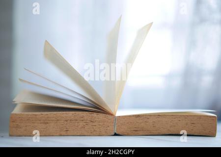 Close up of open books on a table  Stock Photo