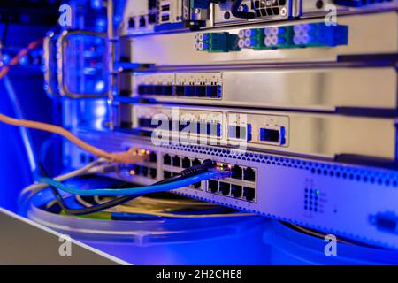Telecommunication technology equipment - fiber optic cables and switch Stock Photo