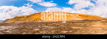 Panorama of the orange, steamy hill at Leirhnjukur, Krafla, Iceland Stock Photo