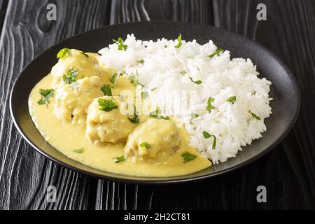 Pork Meatballs in Curry Boller i Karry close up in the plate on the table. horizontal Stock Photo