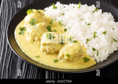 Meatballs in Curry Sauce with rice close up in the plate on the table. horizontal Stock Photo