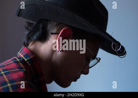Handsome Hispanic man wearing a hat and glasses Stock Photo