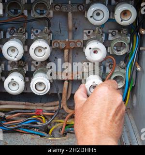 Old power distribution box with ceramic fuses Stock Photo
