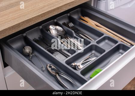 Drawer with cutlery in kitchen Stock Photo
