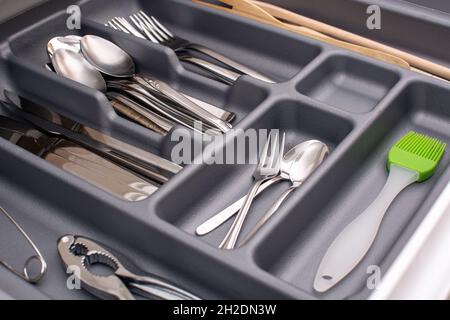 Drawer with cutlery in kitchen Stock Photo