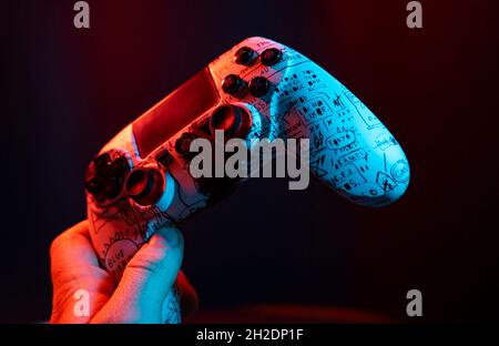 Next Gen game controller on mans hands Stock Photo