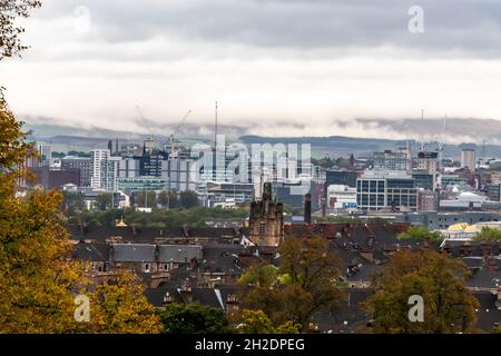 An overcast Glasgow Southside and city centre with mist rising from the Campsie Fells in the background. As viewed from Queens Park. Stock Photo