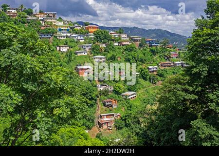 Aerial view over houses on hillside near of Port of Spain, capital city of Trinidad and Tobago in the Caribbean Stock Photo