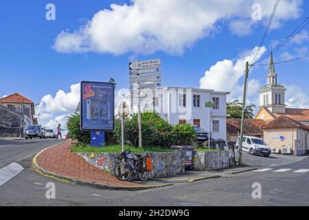 Streetscene at the village Morne-Vert showing church and French street signs on the island of Martinique in the Caribbean Sea Stock Photo
