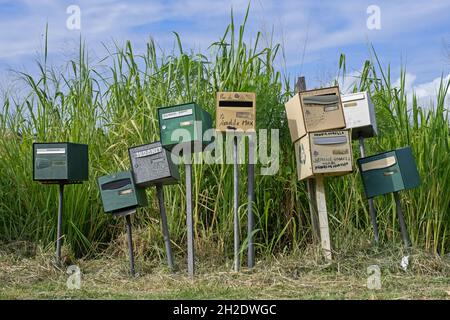 Row of individual mail boxes / letter boxes / mailboxes / letterboxes / postboxes of residents on the French island of Martinique in the Caribbean Stock Photo