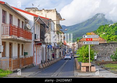 Street in the town Saint-Pierre and active volcano Mount Pelée on the French island of Martinique in the Caribbean Sea Stock Photo