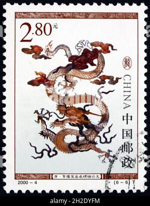 CHINA, PEOPLE’S REPUBLIC OF - CIRCA 2000: a stamp printed in the China shows dragon on sandalwood throne, circa 2000 Stock Photo