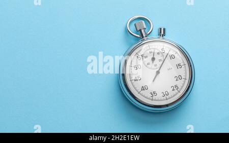 Stopwatch on blue background. Template Copy space for text. Stock Photo