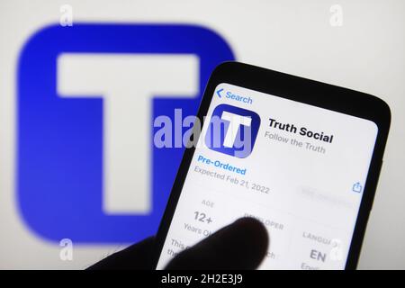 Ukraine. 21st Oct, 2021. In this photo illustration, Truth Social of a social networking platform app is seen for pre-ordered in App store on a smartphone with a background it's logo on a pc screen.Former the US President Donald Trump announced to launch his own social networking platform - Truth Social, that will be owned by Trump Media & Technology Group (TMTG), reportedly by media. Credit: SOPA Images Limited/Alamy Live News Stock Photo