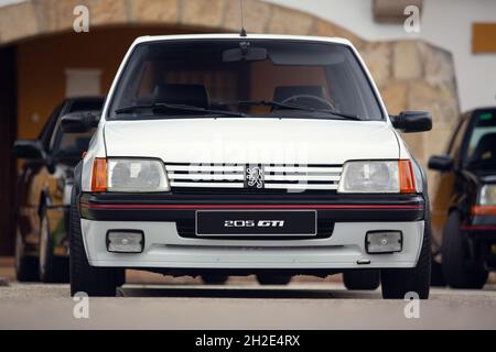 Reocin, Cantabria, Spain - October 2, 2021:  Car show in Reocin. Original white Peugeot 205 GTI. The Peugeot 205 is a car produced by the French manuf Stock Photo