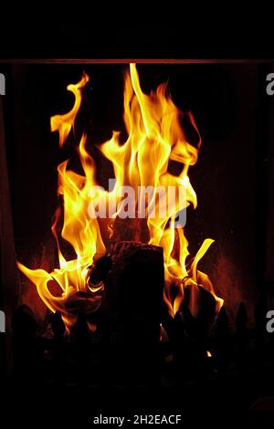 Blazing fire flames in fireplace Stock Photo