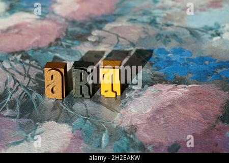 Word ART made of letterpress blocks with its shadows on an oil painting Stock Photo