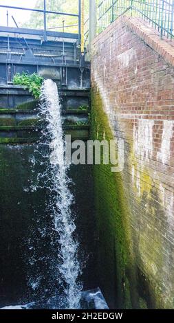 water flowing over an old dam in Bobzin in Mecklenburg-Western Pomerania Stock Photo