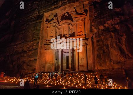 PETRA, JORDAN - MARCH 22, 2017: Tourists visit the Al Khazneh temple The Treasury during Petra by Night in the ancient city Petra, Jordan Stock Photo