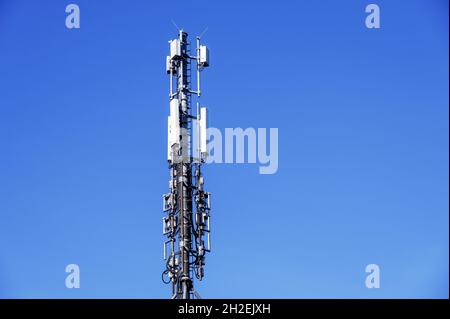 Cell site, cell tower, or cellular base station transmitting radio signals from cellular networks, cordless phones and wireless networks Stock Photo