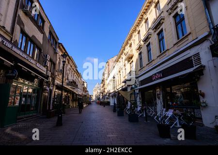 Bucharest, Romania, 22 November 2020 - Street with old buidings in the historic center  on a sunny autumn day Stock Photo