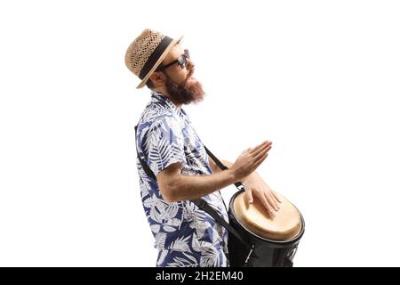 Profile shot of a bearded man playing conga drums and singing isolated on white background Stock Photo