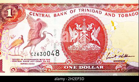 1 Dollar banknote, Bank of Trinidad and Tobago, closeup bill fragment shows Coat of arms, issued 2002 Stock Photo