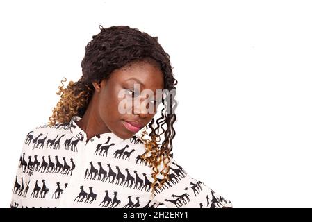 beautiful young african woman standing and thinking looking aside Stock Photo