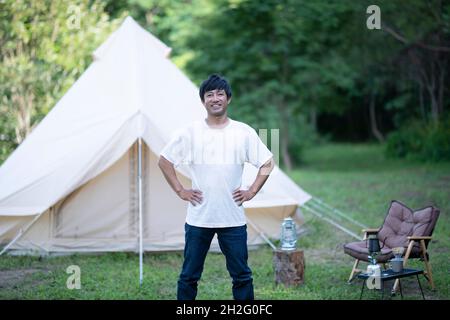 Japanese man solo camping Stock Photo - Alamy