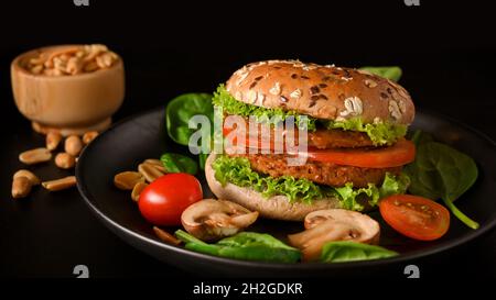 Close-up Plant based burger with fresh organic vegetables, healthy and dietary food concept. Stock Photo