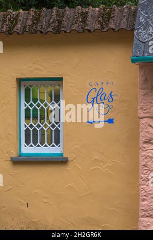 Portmeirion village, Gwynedd, North Wales Caffi Glas sign of wall of Italian restaurant - tourist village Stock Photo