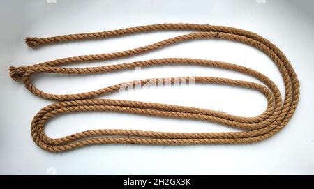 Rough natural rope string on white background Stock Photo