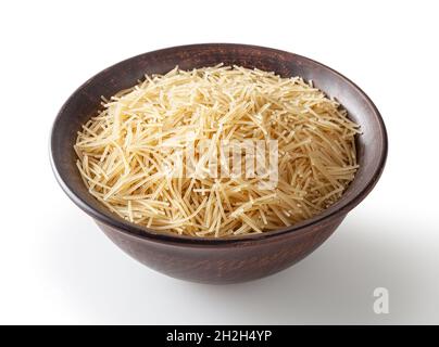Uncooked vermicelli pasta in ceramic bowl isolated on white background with clipping path Stock Photo