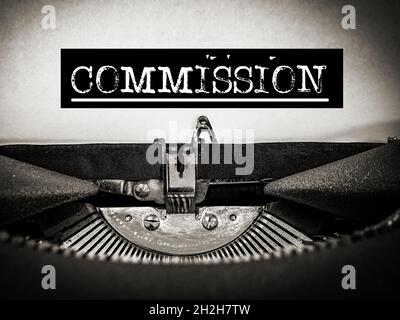 Commission displayed on a Typewriter Stock Photo